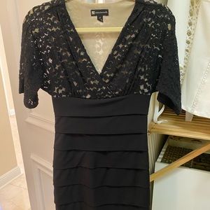 Little black dress with lace sleeves.